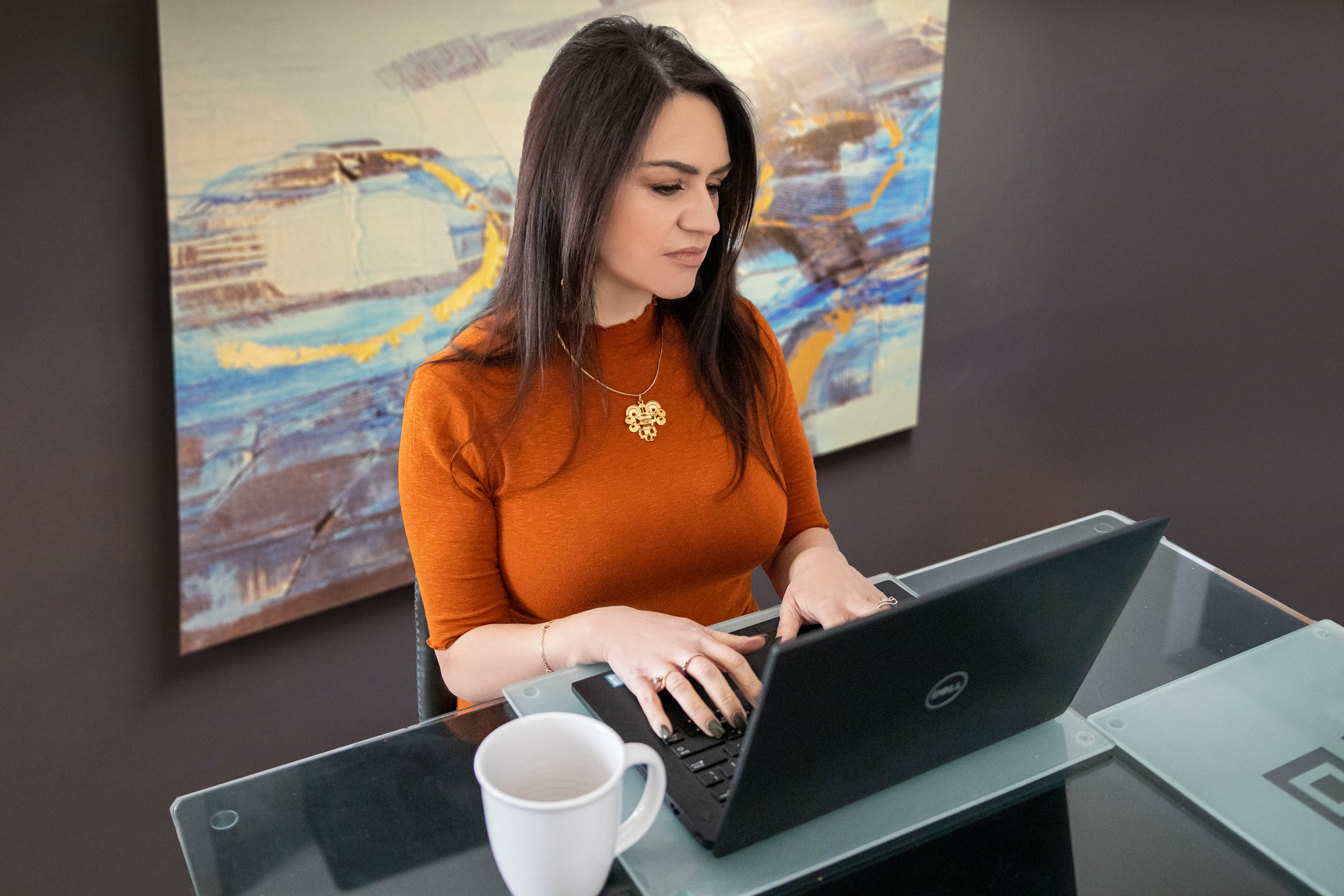 Adriana Rozo-Angulo working at a desk